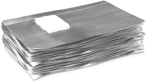 A large pile of paper documents or files, some have a white sticky note on top.