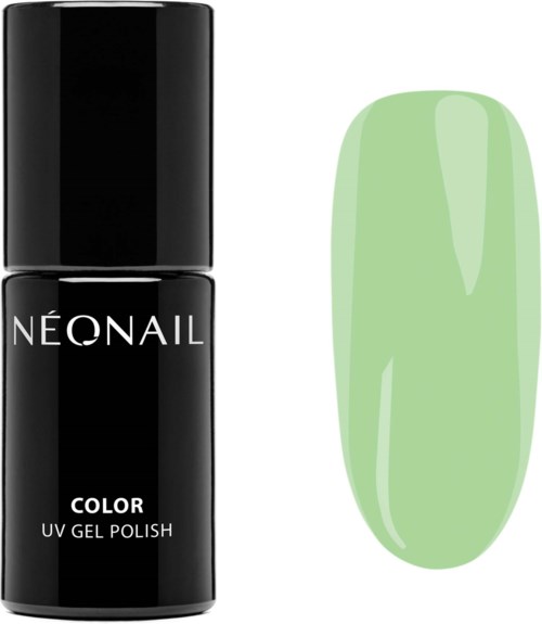 A black bottle labeled 'NÉONAIL' with green nail polish on a nail sample next to it.