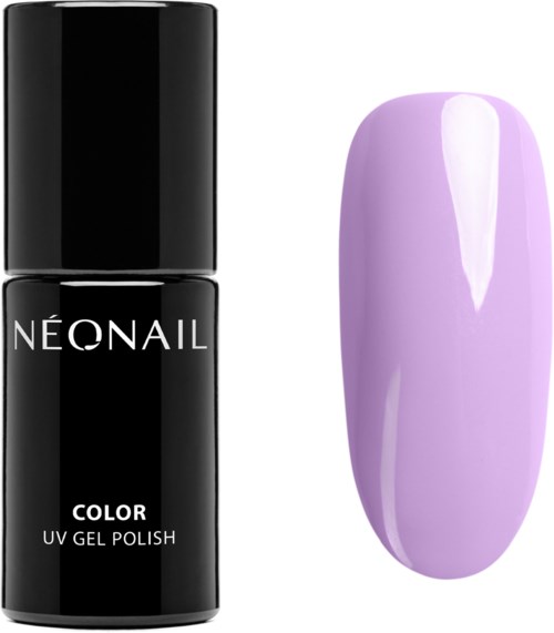 Black nail polish bottle next to a painted purple artificial nail. Both are on a white background.