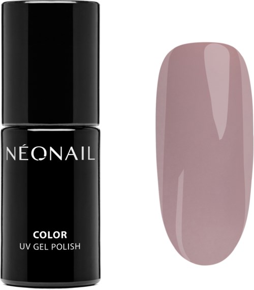 A black bottle of nail polish next to a pink, oval-shaped painted nail.