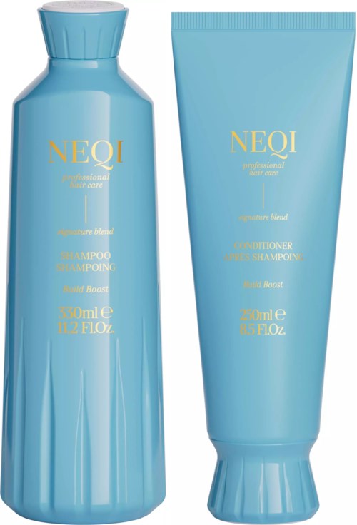 Two blue hair care bottles, one shampoo and one conditioner, with gold text and a sleek design.