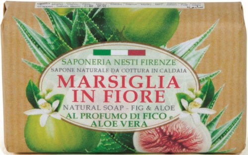 Natural soap with fig and aloe vera, featuring green leaves and a peach on the packaging.