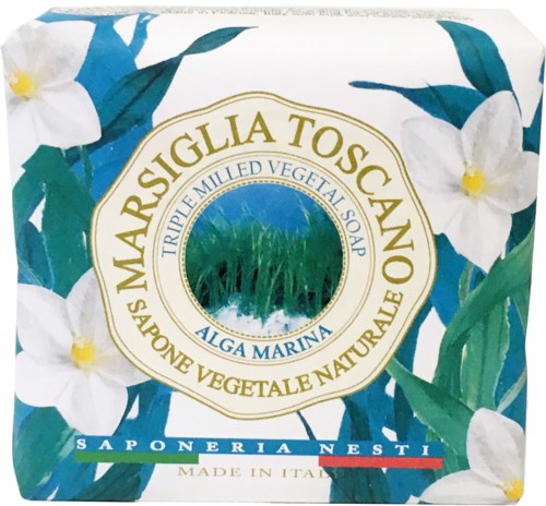 A soap box with green leaves and white flowers design, labeled 'Marsiglia Toscano' and 'Tripe Mille Vegetal Soap'.