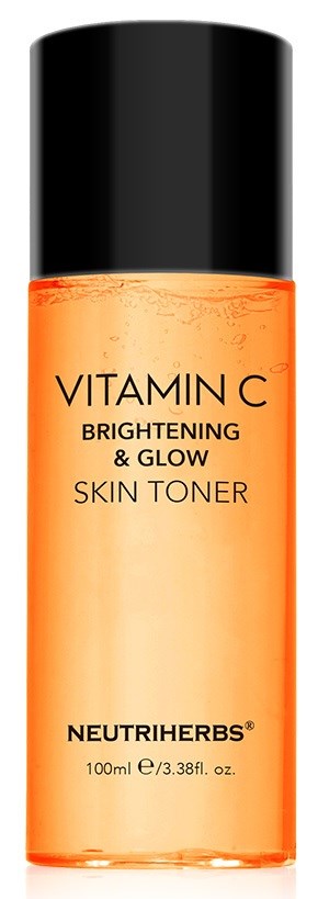 Eine kleine orange Flasche mit schwarzem Deckel, beschriftet 'Vitamin C Brightening & Glow Skin Toner' von Neutriherbs.