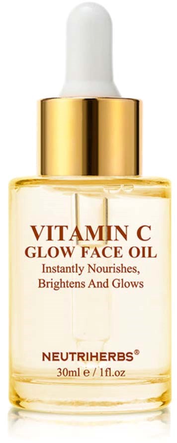 A small glass bottle with a white dropper and gold cap, labeled Vitamin C Glow Face Oil, by NeutriHerbs.