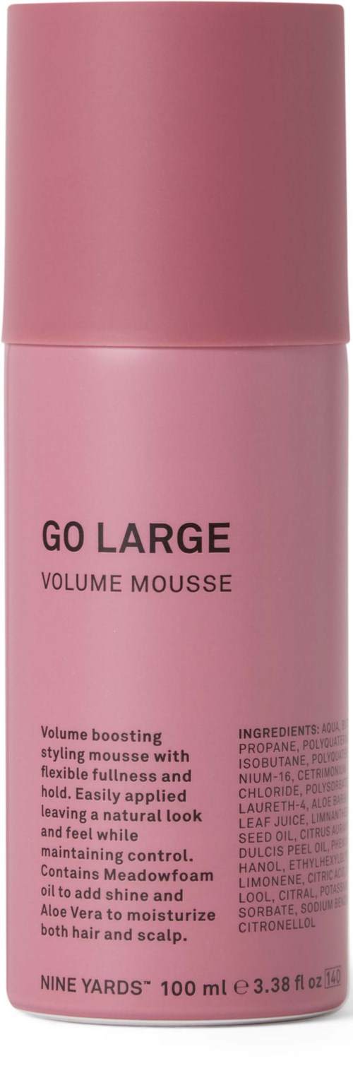 Pink spray can for volume mousse, claims to add shine and texture, contains ingredients like propylene glycol and aloe vera.