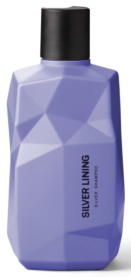A purple, geometric-shaped bottle with a black cap, labeled Silver Lining Silver Shampoo.