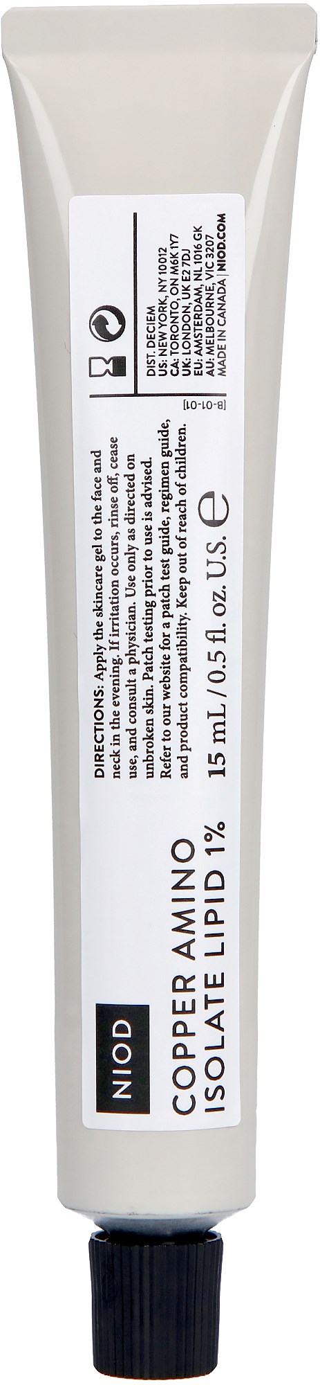 En liten tube med leppepomade merket "Niod Copper Amino Isolate Lipid 1%."