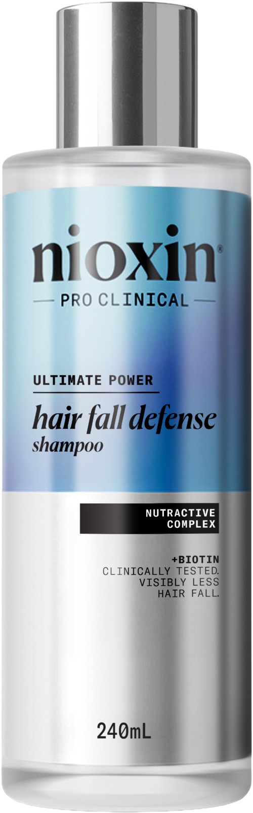 Een zilveren fles Nioxin Pro Clinical haarverliesbestrijdingsshampoo met een blauwe label en zwarte en witte tekst.