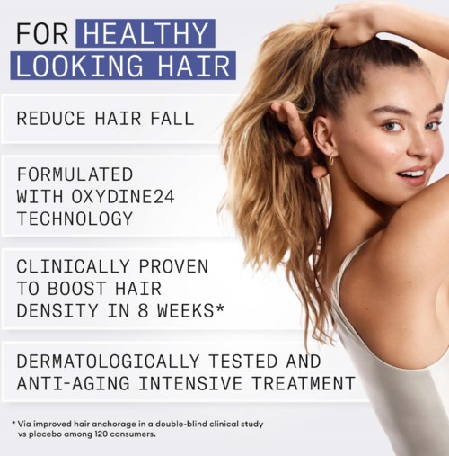 Tekst over een haarproduct dat beweert haaruitval te verminderen met speciale technologie en testen.