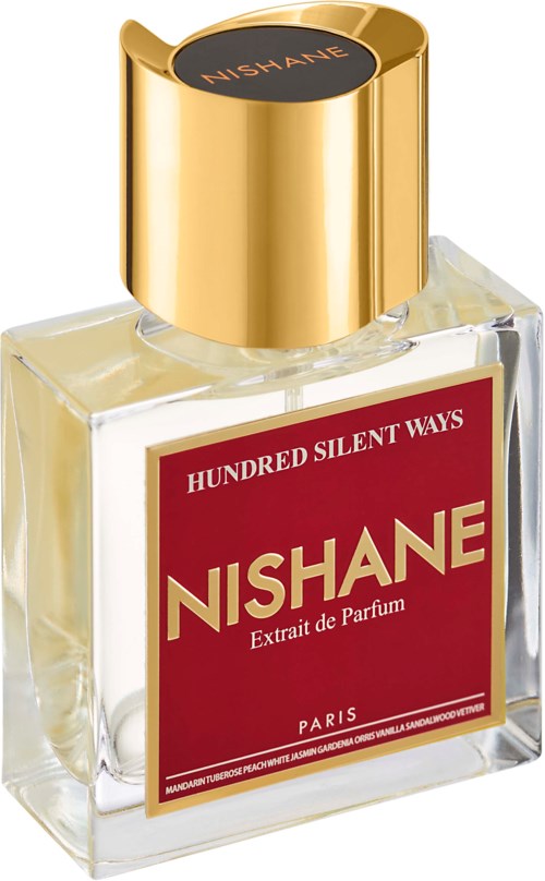 Een parfumfles met een rood label dat 'NISHANE' zegt en een gouden dop.