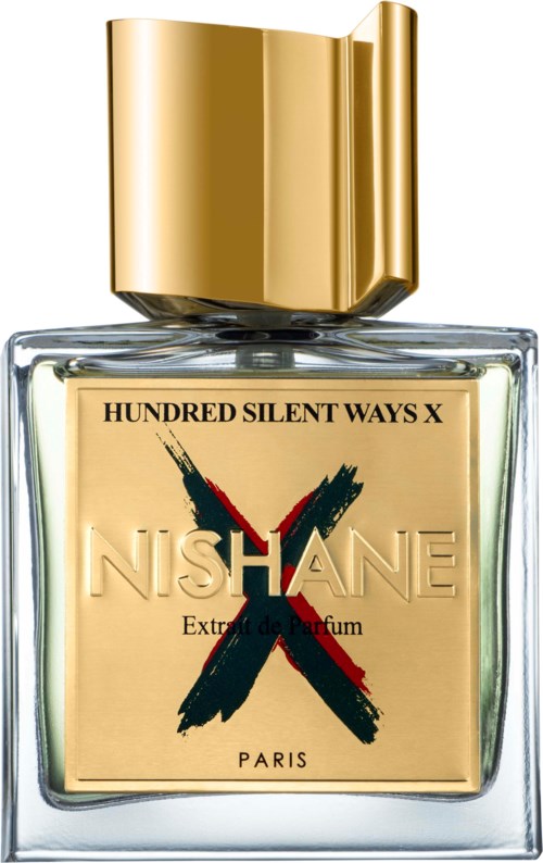 Ein Parfümflasche mit "NISHANE" Beschriftung, großer goldener Kappe und beige Etikett mit einem roten und schwarzen "X".