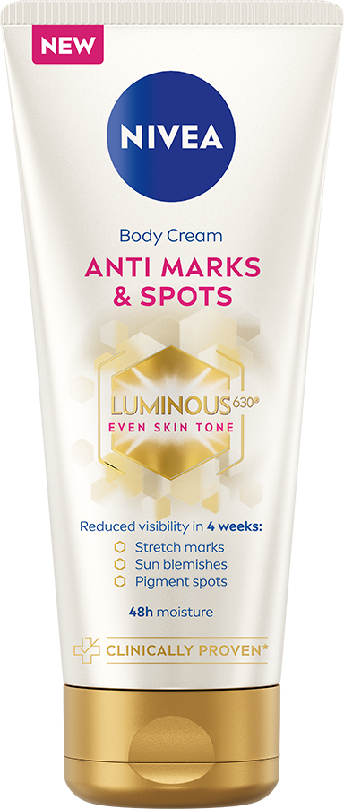 A white tube of Nivea body cream with pink, blue, and gold text and design, claiming to reduce skin marks and spots.