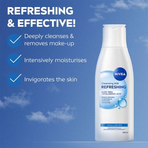 A Nivea cleansing milk bottle with text about its benefits, against a blue sky background.