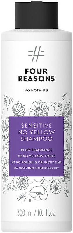 Een witte shampoo-fles met een zwarte dop, met label 'Four Reasons', beweert gevoelig te zijn en zonder gele tinten.