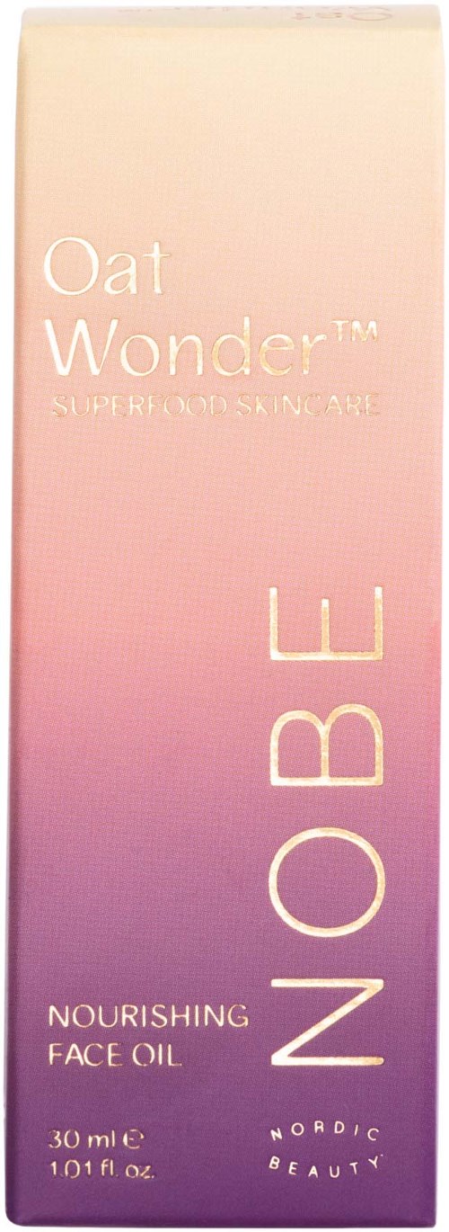 En lång, pastellrosa förpackning med texten 'Oat Wonder', 'Nourishing Face Oil' och 'NO BE'.