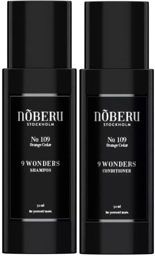 Zwei schwarze Flaschen mit den Labels No 109 Orange Citrus Shampoo und Conditioner von Nöberu Stockholm.