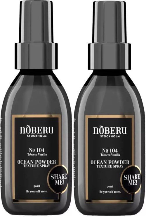 Two bottles of ocean vanilla texture spray with black labels and caps, side by side.
