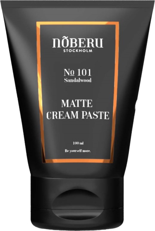 Eine schwarze Tube mit orange und weißen Text, bezeichnet 'NÖBERU Stockholm No 101 Sandalwood Matte Cream Paste.'