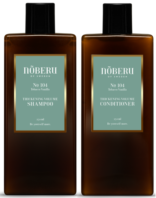 Zwei braune Flaschen mit NÕBERU Shampoo und Conditioner stehen nebeneinander, mit blauer und weißer Beschriftung.