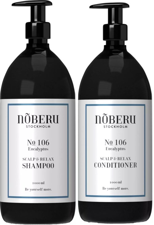 Two black bottles labeled for shampoo and conditioner, both have pumps and white labels with text.