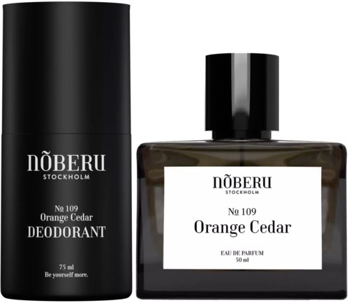 Deodorant- och parfymflaskor från Näberu, Stockholm i orange cedar doft, svarta förpackningar och vita etiketter.
