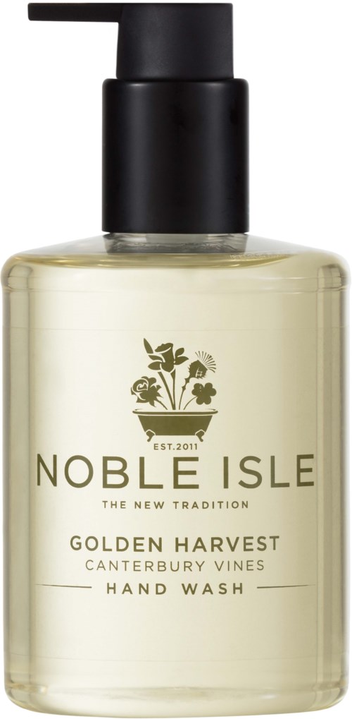 Eine klare Pumpflasche mit schwarzem Deckel, bezeichnet Noble Isle Golden Harvest Hand Wash, mit Pflanzenlogo und goldener Schrift.