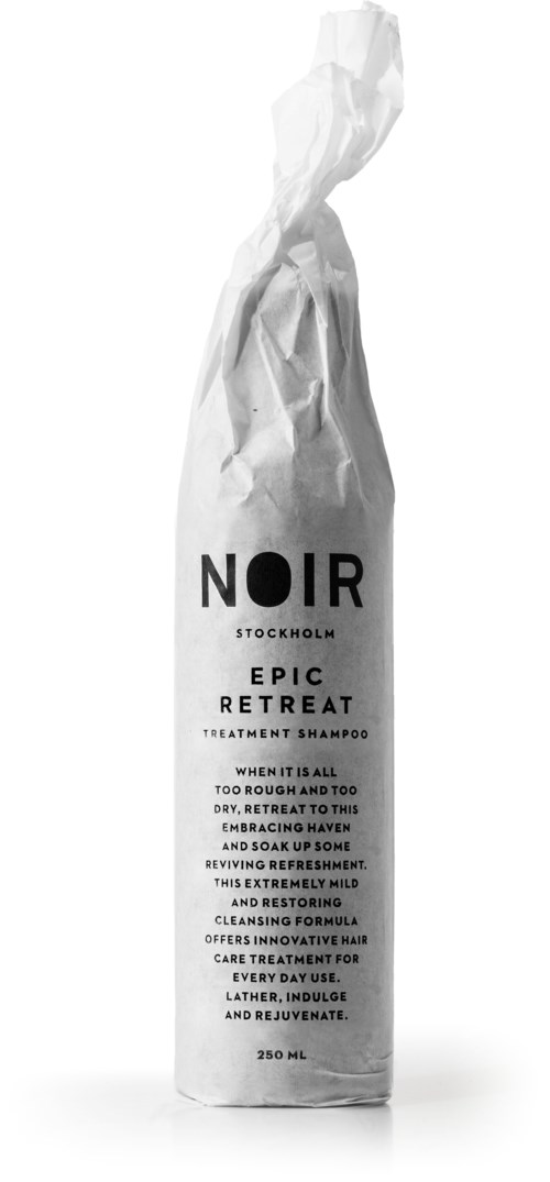 A white shampoo bottle with black text, labeled 'NOIR STOCKHOLM EPIC RETREAT' and detailed description.