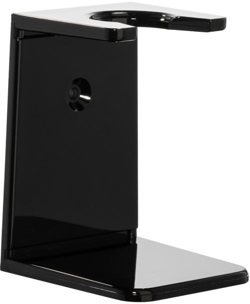 A sleek, black coffee maker with a simple design. It has a flat base, a vertical body, and a spout for pouring.