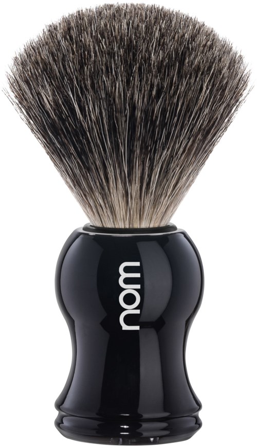 A shaving brush with a black handle and dense, soft bristles, used for applying shaving foam.