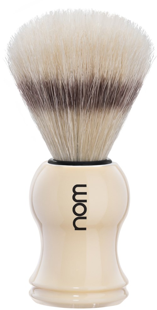 A shaving brush with a cream-colored handle and soft, dense bristles that are darker at the base.
