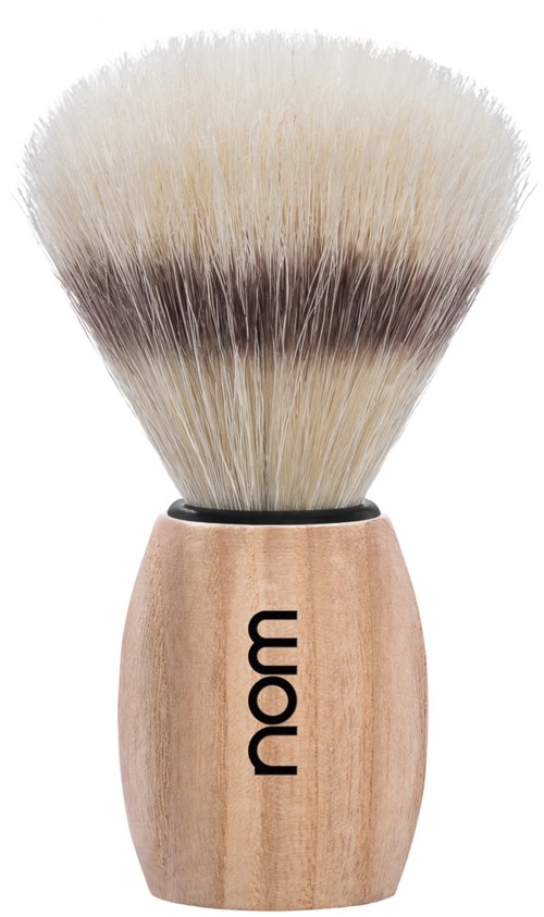 A shaving brush with a wooden handle and soft, light-colored bristles. The handle has the word "nam" printed on it.