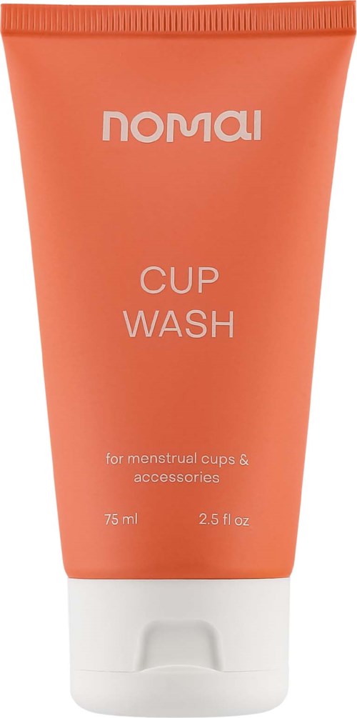 Eine kleine pfirsichfarbene Tube mit weißem Deckel, beschriftet 'Nomaw' und 'Cup Wash' für Menstruationskappen und Zubehör.