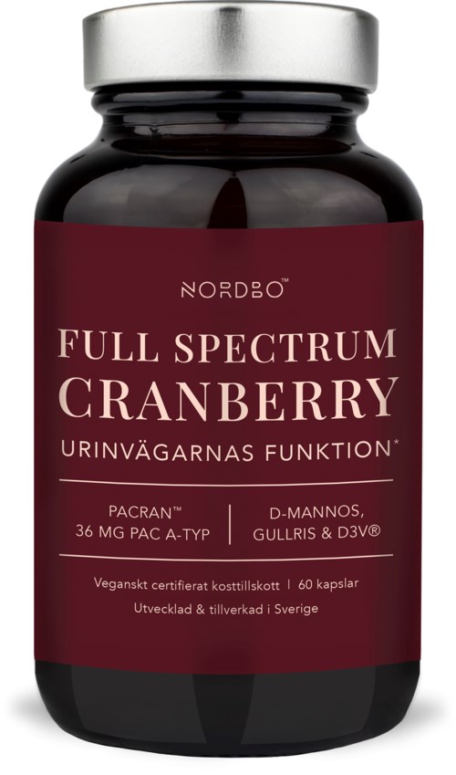 En mørk flaske med rød etikett, viser produktnavnet Full Spectrum Cranberry og ingredienser. Produsert i Sverige.