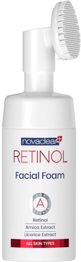 Eine weiße Flasche mit Gesichtsreiniger und Bürste, mit 'Retinol' beschriftet, geeignet für alle Hauttypen.
