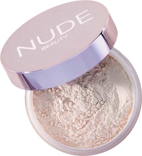 Een ronde container met een roze deksel waarin 'NUDE BEAUTY' staat, bevat losse beige poeder.