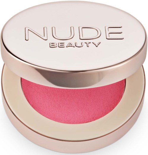 Pyöreä meikkituote, jonka sisällä on pinkkiä puuteria, ja labelinä 'NUDE BEAUTY'.