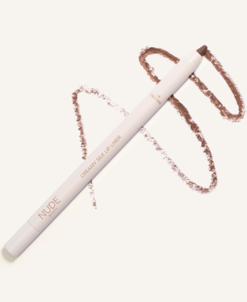 A white makeup pencil labeled 'NUDE' with brown lines drawn around it on a white background.