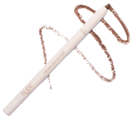 A white makeup pen with pinkish swirls around it, lying flat. It says 'NUDE' and 'CREAMY SILK UP LINER'.