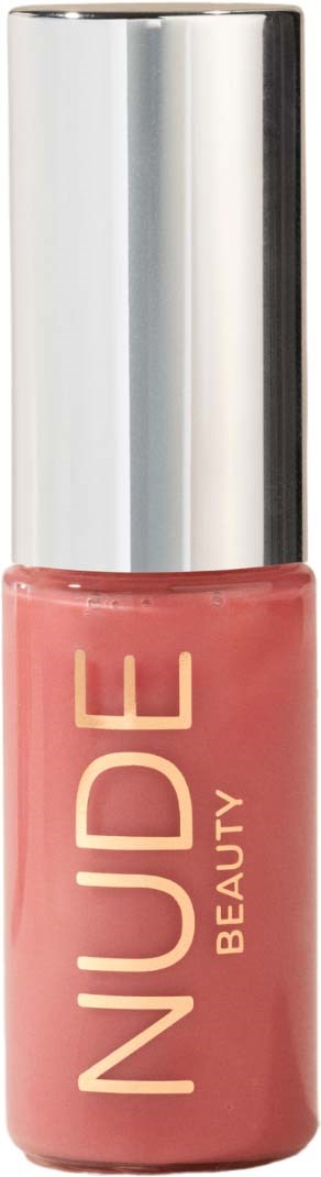 A pink nail polish bottle with a shiny silver cap and the word "NUDE" on it.