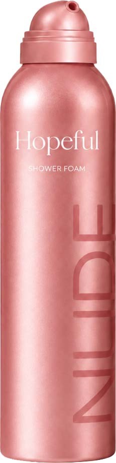 En rosa sprayflaska med shower foam, där ordet Hopeful och stor vertikal text NUDE syns.