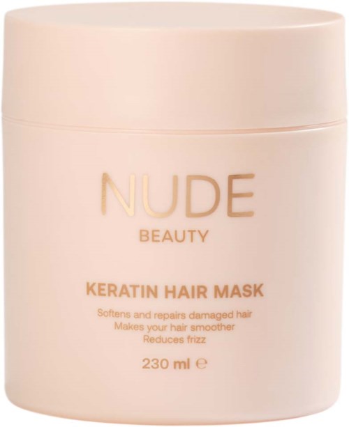 A round, light-colored container labeled NDA BEAUTY, containing keratin hair mask for damaged hair healing and smoothing.