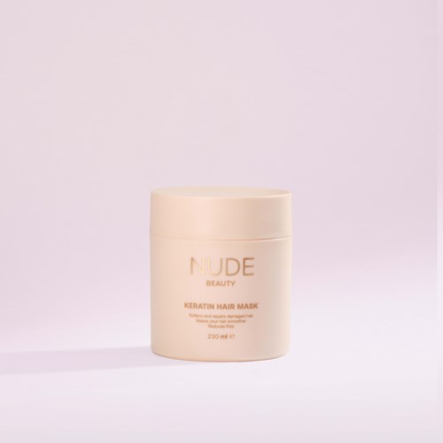 A beige container of Nude Beauty Keratin Hair Mask on a light background.