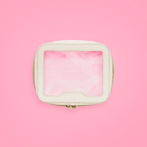 A small white case with a clear window on a pink background.