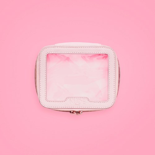 A small white case with a transparent front, placed on a pink background.