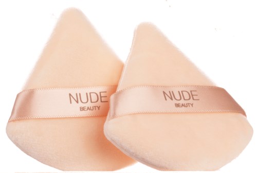 Soft, peach-colored beauty sponges with "NUDE BEAUTY" ribbon for makeup application.