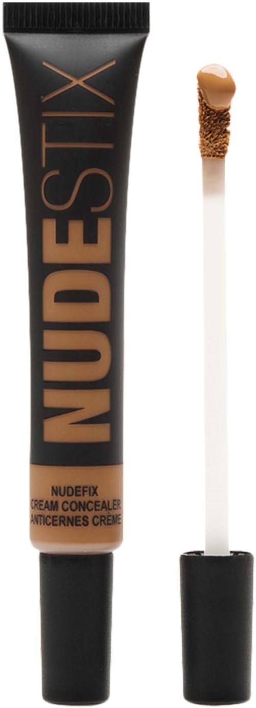 A tube of Nudesitx concealer with a wand applicator and a beige shade.