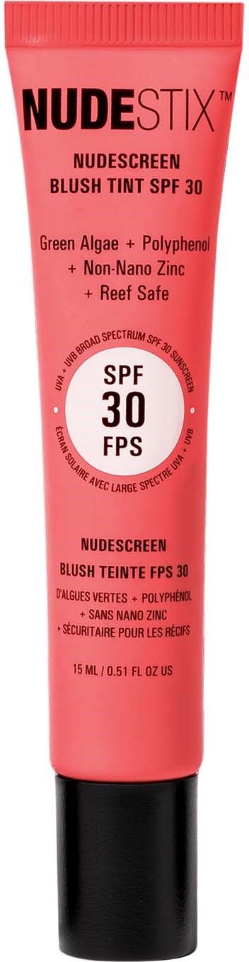 Vaaleanpunainen tube of NUDESTIX blush tint SPF 30, sisältää vihreää levää, polyfenoleja ja sinkkiä, turvallinen koralleille.