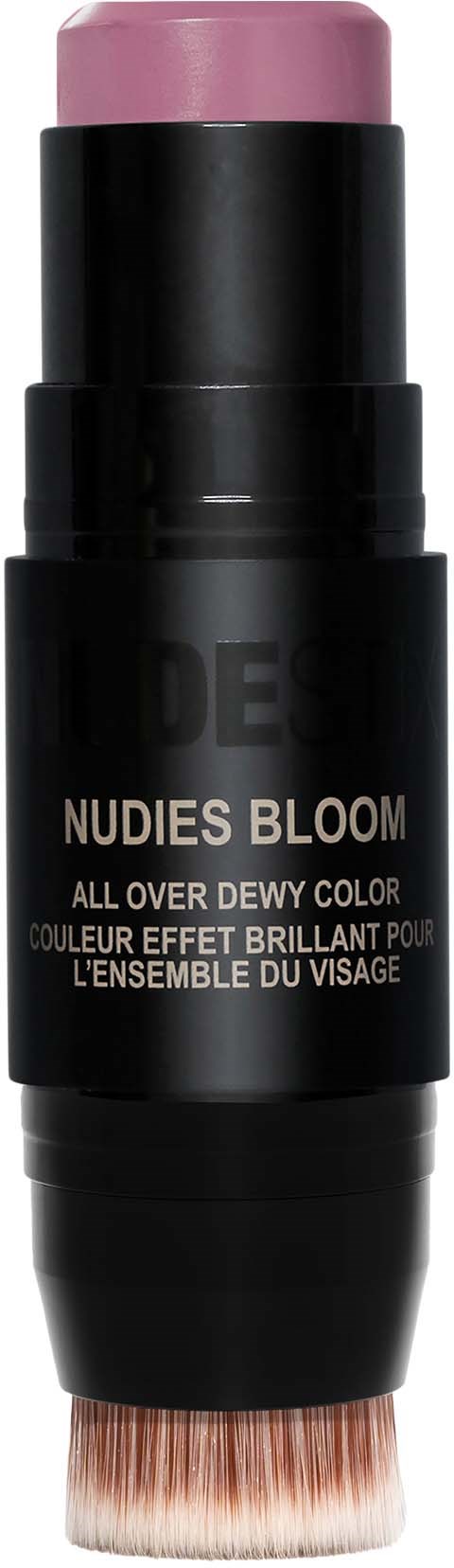 A makeup stick with pink color on top, black body, and a brush at the bottom. Label reads 'Nudies Bloom' and mentions face color.
