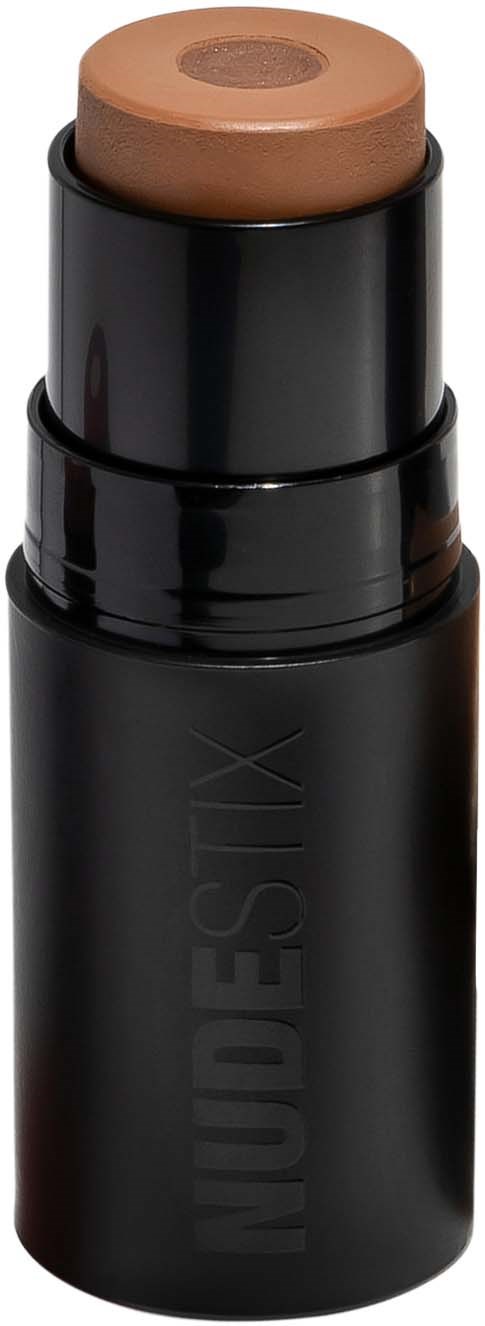 Een make-upstick met een bruine tip in een zwart geval, gemerkt 'NUDE SLIX'.